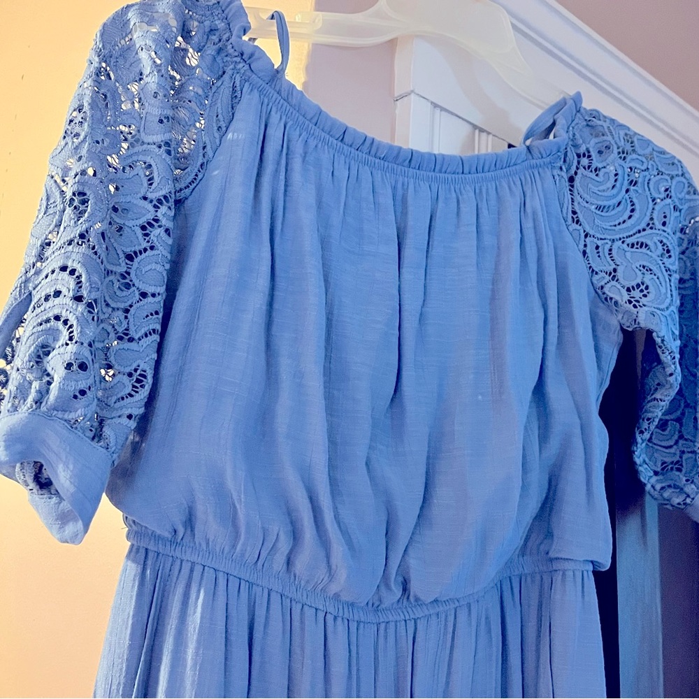 Girls dressy romper with crochet/lace style sleeves. Pretty in blue